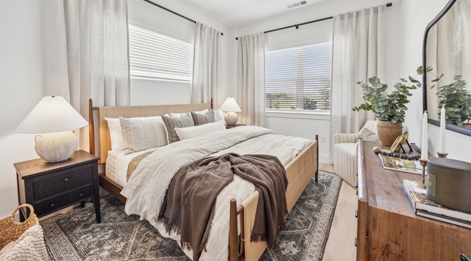 a bedroom with a bed and two nightstands